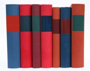 row-of-colorful-books-on-white-background